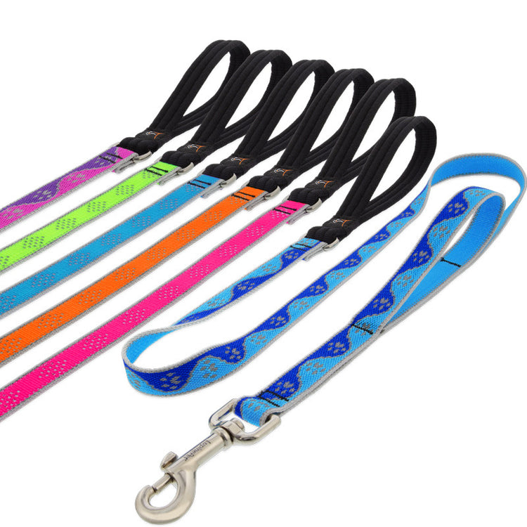 Double handle dog leashes in assorted reflective designs on a white background